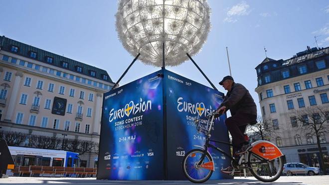 A man cycles past the Eurovision Song Contest countdown clock in Stockholm, Sweden, on 2 May 2016,