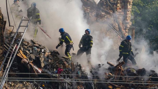 Rescuers work to clear the rubble of a residential building destroyed by a ''kamikaze drone'' attack in downtown Kyiv on Monday 17 October