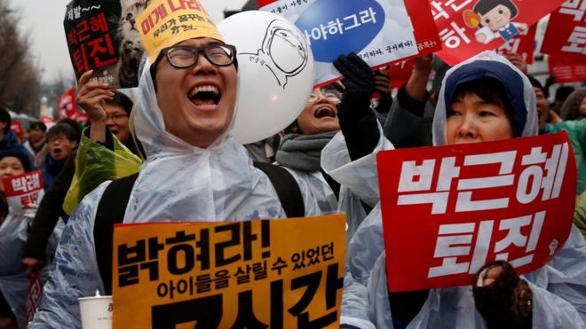 Protesters shout slogans at a protest calling South Korean President Park Geun-hye to step down in Seoul, South Korea