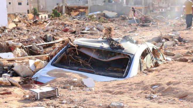 Car engulfed in mud and rubble