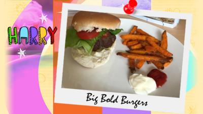 A plateful of a big burger in a white bun with tomato and lettuce, plus sweet potato fries, ketchup and mayo.