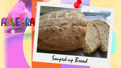 A picture of a delicious loaf of bread with two slices cut already, sent in by Allegra.