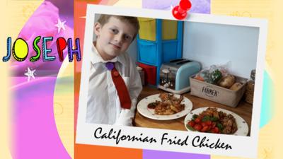 A little boy (Joseph) standing next to a countertop, displaying Californian Chicken.