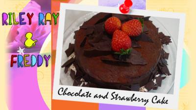 A extra chocolatey chocolate cake decorated with strawberries by Riley Ray and Freddie.
