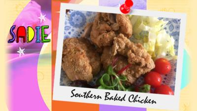 A picture of Baked Southern Chicken by Sadie, complete with green salad and red tomatoes.