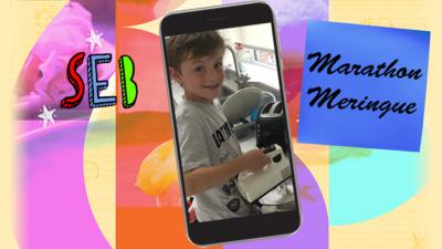 A little boy (Seb) smiling and using an electric whisk to make marathon meringues.