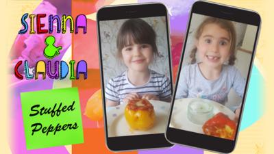 Two little girls with stuffed peppers.