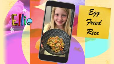 A girl (Ellie) smiling with a bowl of egg fried rice.