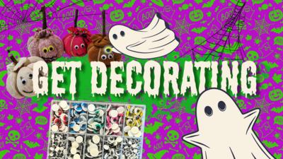 A striking image with ghosts and skulls on the background with the text "get decorating" in a spooky, gooey font, two ghosts place googly eyes on a halloween sock pumpkin.