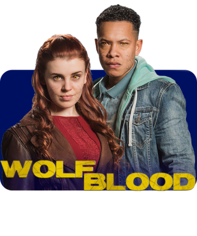 A girl with long red hair stands next to a tall boy in a demin jacket behind the Wolfblood logo (Jana and TJ).