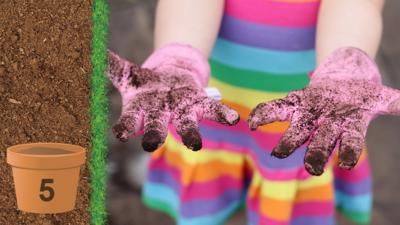 A childs hands wearing gardening gloves that are covered in soil