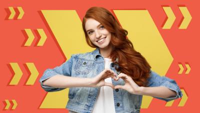 Young girl in denim jacket making a heart with her hands