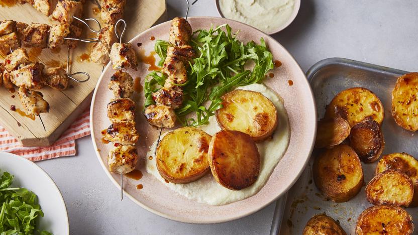 Chicken skewers with lemon-roasted potatoes and whipped feta