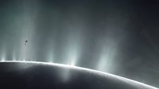Illustration of Cassini Spacecraft Diving Through Plume of 'Ocean World' Enceladus