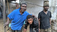 These former combatants live in a derelict house and try to earn their living by fixing old tyres by the side of the road