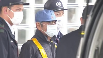 Carlos Ghosn in face mask as he leaves jail