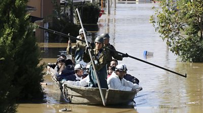 Local residents are rescued by Japapnese Defence-Force soldiers from a flooded area caused by Typhoon Hagibis in Kakuda