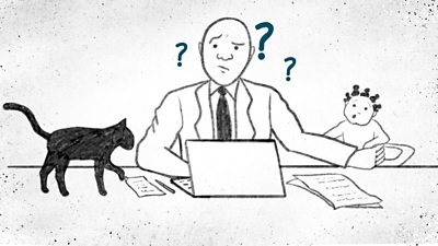 Man sitting at a desk, laptop open, black cat on his right and baby on his left. There are question marks around his head.