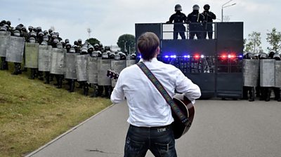 Rock musician Pit Pawlaw singing at a protest rally in Belarus