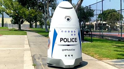 Robocop patrolling a park in LA