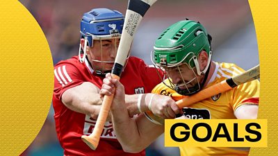 Cork and Antrim players tussle