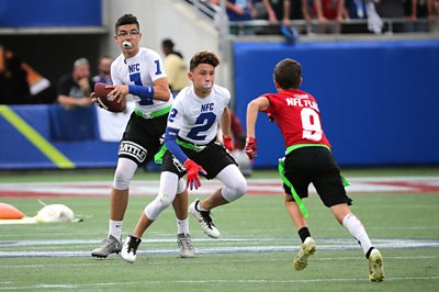 Children playing at the NFL Flag Football Championship in 2018.