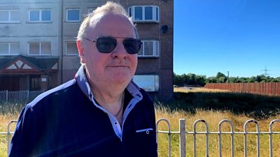 A Wishaw housing estate is due to be demolished, but last resident Nick Wisniewski is determined to stay.