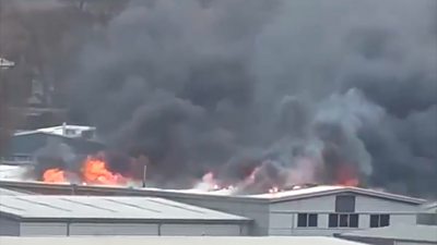 Fire comes through roof of Andover warehouse