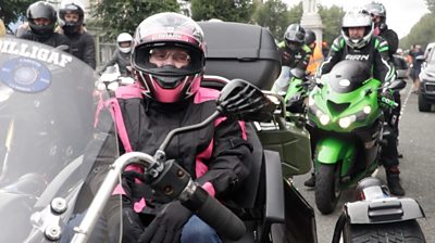 83-year-old Leonie on the back of a Harley Davidson trike