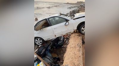 Car washed away by water in Libya