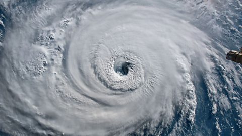 Aerial photograph of a hurricane.