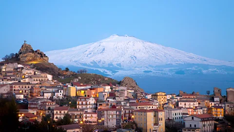 Mount Etna with Italian town in the foreground