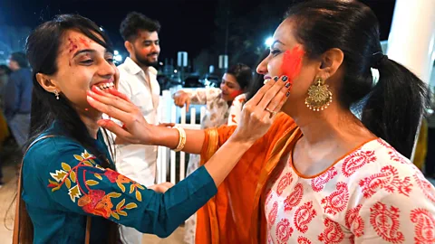 Women enjoying Holi festival in the US