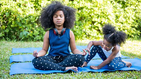 Sisters practising yoga