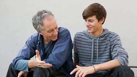 Father and son chatting amiably