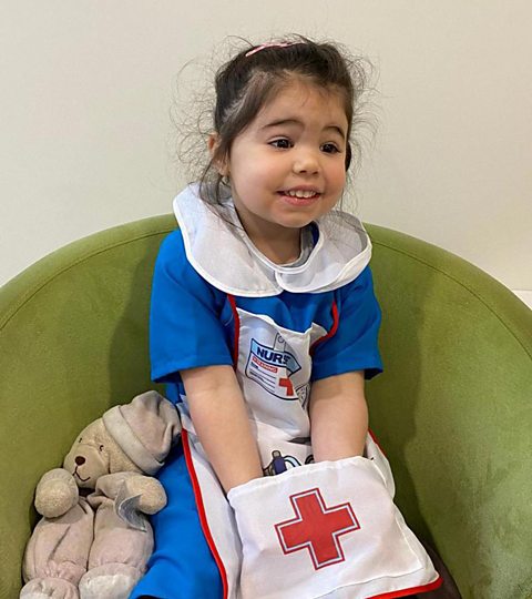 young girl dressed as a nurse 
