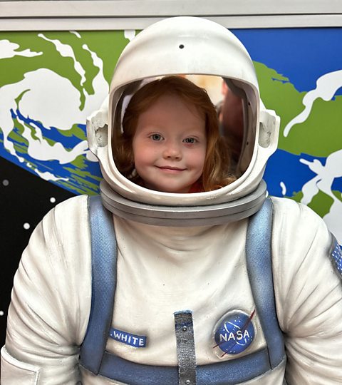 young girl dressed as an astronaut