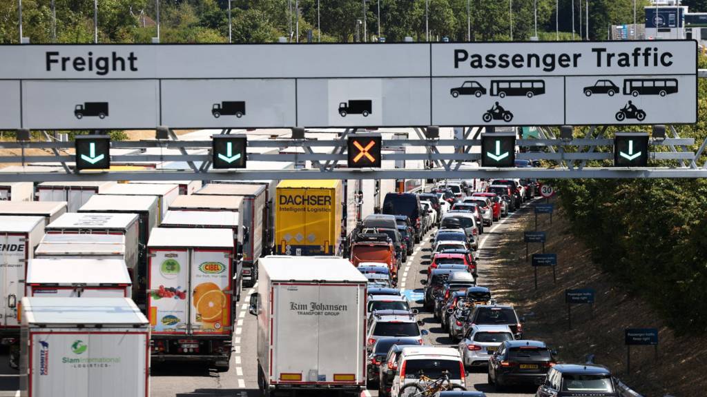 Vehicles queue to enter the Eurotunnel terminal in Folkestone