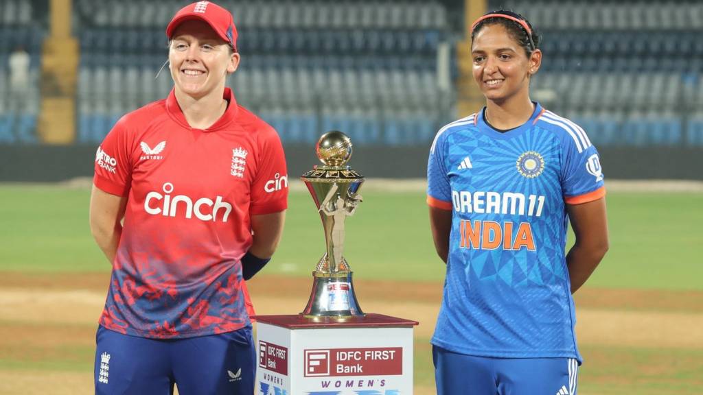 England captain Heather Knight (left) and India captain Harmanpreet Kaur (right) stand either side of the T20 series trophy