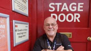 Tony Bell standing outside of the Stage Door