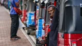 A man waiting for fuel in Colombo, Sri Lanka