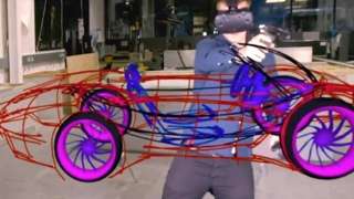 Man drawing virtual car wearing VR headset