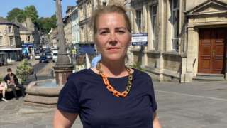 Leader of Frome Town Council, Lisa Merryweather-Millard, standing on the high street
