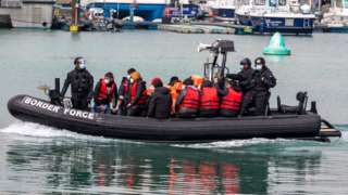 A group of people thought to be asylum seekers brought into Dover by Border Force