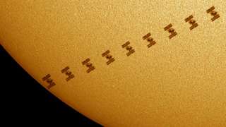 International Space Station against the Sun