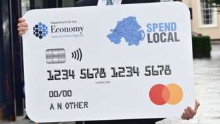 A giant version of the Spend Local card