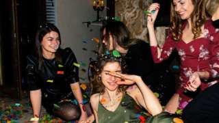 Young women at house party
