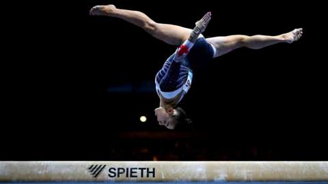 Jessica Gadirova doing a flip on the beam