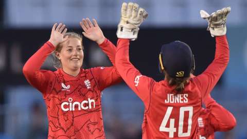 England bowler Sophie Ecclestone (left) celebrates a wicket with wicketkeeper Amy Jones (right)