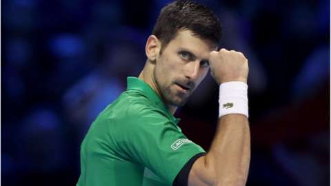 Novak Djokovic pumps his fist in celebration